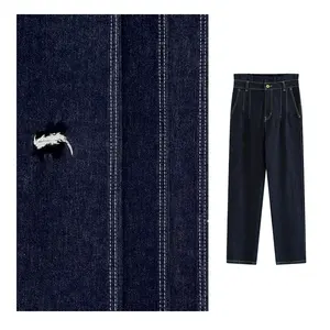 Stock OE fil jeans tissu sergé teint en rouleau jeans tissu indigo spandex denim tissu pour les fabricants de vêtements avec vente en gros