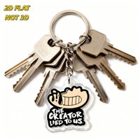 Divertente Portachiavi in Acrilico con Faccina Sorridente 'The Creator Lied to Us', Design Ispirato ai Meme con Humor Nero, Bordo Trasparente, Anello in Metallo e Catena