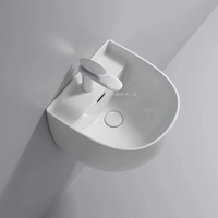 Ensemble de toilettes contemporaines avec cuvette à chasse d'eau et lavabo mural en céramique, chasse d'eau par gravité, toilettes monobloc rondes
