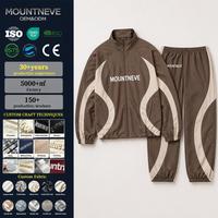 Conjunto Deportivo de 2 Piezas para Hombre, Chaqueta con Cuello Alto y Cierre Completo, Paneles en Contraste, Pantalones Deportivos con Cintura Elástica y Cordón Ajustable, Producción OEM