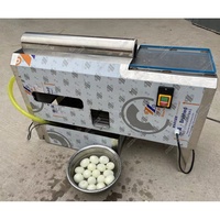 Machine durable et hygiénique pour écraser et peler les œufs durs