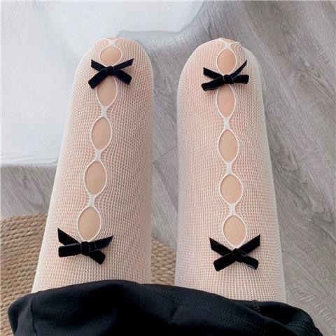 Beige base with black bow