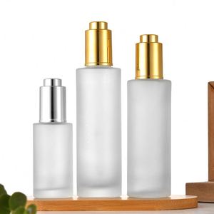 30 ml Clear Frosted <b>Press</b> Luxury Push <b>Button</b> Gold Pipette Essential Oil Glass Bottle with Gold Silver Top - Product Image 1