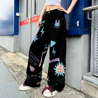 Jean en denim blanc déchiré pour homme, style américain, avec graffiti peint à la main et imprimé dessin animé, coupe ample et jambe large