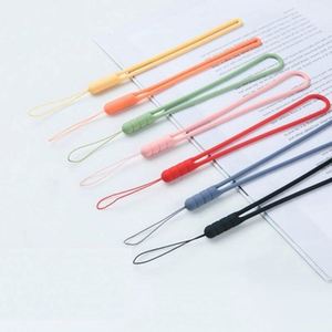 Promoción al por mayor: Soporte de silicona suave para teléfono móvil con cordón corto de goma - Product Image 4