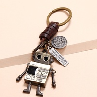 Porte-clés robot dessin animé rétro unique et simple, en cuir véritable, avec bras et jambes mobiles, fabriqué en Chine, accessoire créatif pour sac