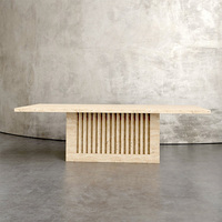 Table à manger en marbre sculpté avec base à rainures, style minimaliste, pour décoration intérieure haut de gamme