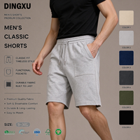Shorts en tricot pour homme avec poche plaquée, gris chiné, taille élastique avec cordon de serrage, poche arrière à rabat avec embout métallique, coupe décontractée pour l'entraînement