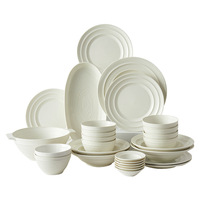 Vaisselle en céramique en gros directement de l'usine : Ensemble de bols et assiettes en porcelaine blanche minimaliste, style crémeux, compatible micro-ondes