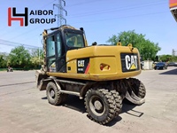 Excavatrice sur pneus d'occasion Caterpillar M315D M312 M317D2 en stock / Machine de terrassement sur roues Cat America originale à vendre