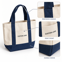 Sac fourre-tout en toile personnalisé haut de gamme avec logo brodé, bordure contrastante et base robuste, idéal pour les vacances à la plage ou en station balnéaire