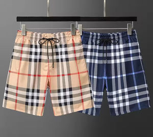 Shorts de sport pour hommes en polyester 100% de haute qualité, tissés, taille mi-haute, imperméables, respirants, écologiques, décontractés, pour la plage, la salle de sport, le basketball - Product Image 1