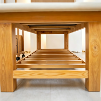 Table de massage robuste en cuir PU avec cadre en bois, repose-tête et rangement à lattes pour salon de beauté