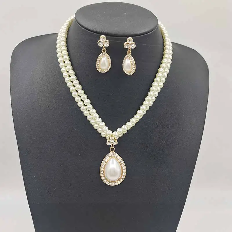 Versand bereit Neues Design Damen Elegante Perlenkette Ohrringe Set Braut mode Legierung Wasser tropfen Anhänger Zweiteiliger Schmuck