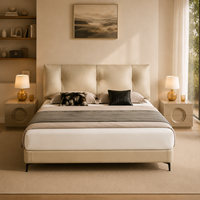 Lit moderne beige écologique en cuir véritable rembourré avec des tables de chevet circulaires et une tête de lit rembourrée