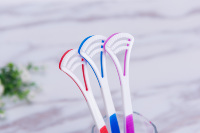 Nettoyeur de langue en silicone souple, grattoir de haute qualité avec revêtement plastique coloré, brosse de nettoyage