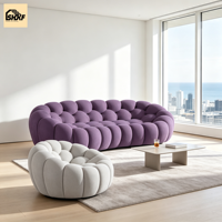 Ensemble de canapés modulaires ronds en tissu bouclé sur mesure, dossier en forme de biscuit, pour réception d'hôtel et salon de villa