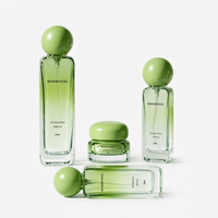 Ensemble de flacons et pots de luxe personnalisés en verre vert pour sérum, lotion et crème, avec couvercle extérieur sphérique, pour marques cosmétiques