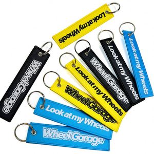 Promotional Wholesale Custom Brand Name Travel Souvenir Woven Embroidery Logo Fabric Keychains - Product Image 1