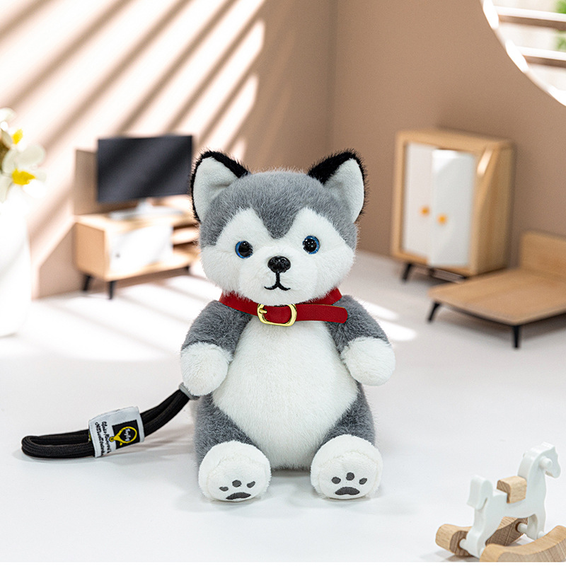 Husky sentado de 15 cm.