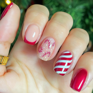 24 faux ongles à presser, nouveau modèle de Noël, motif canne à sucre rouge, style French Manucure, classiques à rayures rouges et blanches, festifs, vente en gros - Product Image 1