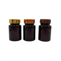 Botella de plástico PET de 80 ml color ámbar para suplementos de salud, con tapa dorada y diseño abatible con serigrafía.