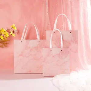 Label pribadi merek Navy kreatif merah muda mewah toko ritel hadiah kemasan seni kertas belanja hadiah tas dengan Logo cetak pegangan