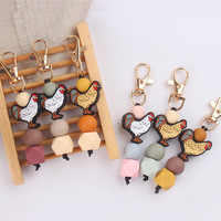 Jouet de dentition créatif DIY en forme de coq de dessin animé, fait main en silicone perlé, pendentif de sac et porte-clés, emballé individuellement pour clés de voiture et sacs