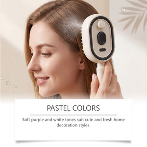 Peine Eléctrico para Masaje del Cuero Cabelludo con Tecnología de Vibración para el Cuidado del Cabello e Hidratación en Colores Morado, Rosa y Beige - Product Image 4