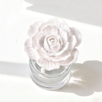 Vente en gros 100ML bouteille en verre parfumé céramique porcelaine fleur arôme plâtre désodorisant parfum de maison diffuseur d'huiles essentielles