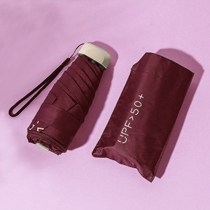 Parapluie de poche minimaliste, pliable manuellement, pour le soleil et la pluie, UPF50+, tissu en nylon, style simple, couleur rouge - Product Image 1
