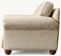 Fauteuil inclinable en tissu de lin style ferme traditionnel, avec accoudoirs roulés et pieds en bois tournés, pour salon