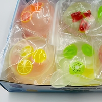 Balle anti-stress sensorielle translucide en forme de tranche de fruit à l'huile de coco, jouet à presser 3+