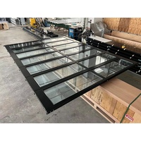 Fournisseur de portes de garage en aluminium blanc de 16 pieds de large et 8 pieds de haut avec cadre en alliage d'aluminium et verre isolant transparent ou givré