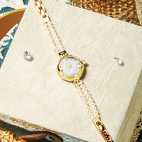 Nouveauté, bracelet-montre pour femme en alliage léger et luxueux, élégant, double rangée de perles d'eau douce, créatif, haut de gamme, sens du style