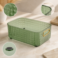 Panier de rangement transparent haut de gamme avec poignées dorées et design empilable pour maquillage, cosmétiques et articles de toilette