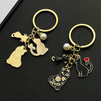 Porte-clés chat noir émaillé style dessin animé avec perle et cœur, pendentif de sac en métal – Grande Vente