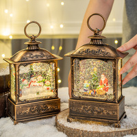 Décorations de Noël transfrontalières : Lanterne en plastique à thème Père Noël, boîte à musique, boule de cristal lumineuse, petits cadeaux de Noël pour les fêtes