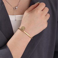 Yiwu Aceon acier inoxydable élastique perle étroite incurvée plaques signalétiques barre côté estampage disque breloque perle Bracelet