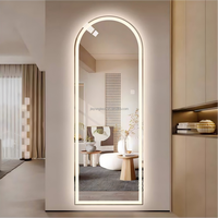Miroir intelligent mural en verre cintré avec LED et interrupteur tactile pour salle de bain