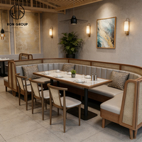 Ensemble de meubles de restaurant moderne et simple en bois, marbre et rotin, avec banquette rembourrée, table et chaises, pour hôtel, café et usage commercial