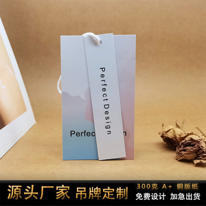 ป้ายแขวนสั่งทำแบบกำหนดเองของ Wenzhou Jushixin Packaging รูปทรงสี่เหลี่ยมผืนผ้า กระดาษเคลือบ ปั๊มนูน ปั๊มร้อน สำหรับเสื้อผ้าและรองเท้า - Product Image 4