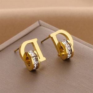 Pendientes colgantes de acero inoxidable que no se desvanecen, con engaste de bisel, en oro y oro rosa, de moda, para venta al por mayor transfronteriza entre Europa y Estados Unidos - Product Image 4