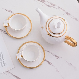 ชุดกาแฟพร้อมถ้วยและจานรองลายผีเสื้อขอบทองลายนูนสีขาวขายดี - Product Image 4