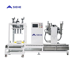 Machine de remplissage de peinture à double tête avec système de bouchage <span class=keywords><strong>pour</strong></span> seaux et bidons, machine d'emballage et de remplissage <span class=keywords><strong>pour</strong></span> laque et vernis - Product Image 1