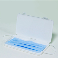 Portable petit porte-masque en plastique à double boucle boîte de rangement latérale anti-poussière et humide pour un usage domestique Design ouvert créatif