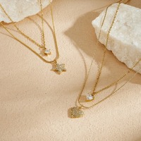 Collier double couche chic avec pendentif cœur et étoile en zircon pavé étincelant, chaîne irrégulière, bijoux haut de gamme pour femmes en gros TGXL14809