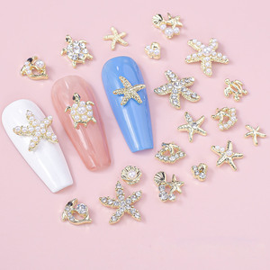 จี้ตกแต่งเล็บ 3 มิติ รูปทรงแบน สีทอง ทำจากโลหะผสม รูปปลาโลมา ปลาดาว เต่า เปลือกหอย น่ารัก สไตล์ฤดูร้อน ประดับด้วยเพชรพลอย - Product Image 2