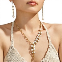 Collier tendance pour femme Milis, best-seller, fait main, en acier inoxydable plaqué or 18 carats, avec pendentif en coquillage perlé