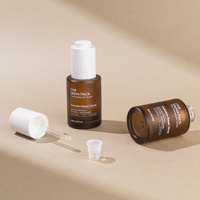 Emballage de flacon de sérum de 30ml 50ml 60ml Flacon compte-gouttes en verre ambré à bouton-poussoir Flacon d'huile facial à épaule plate